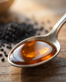 Cold-pressed black seed oil bottle, front packaging view