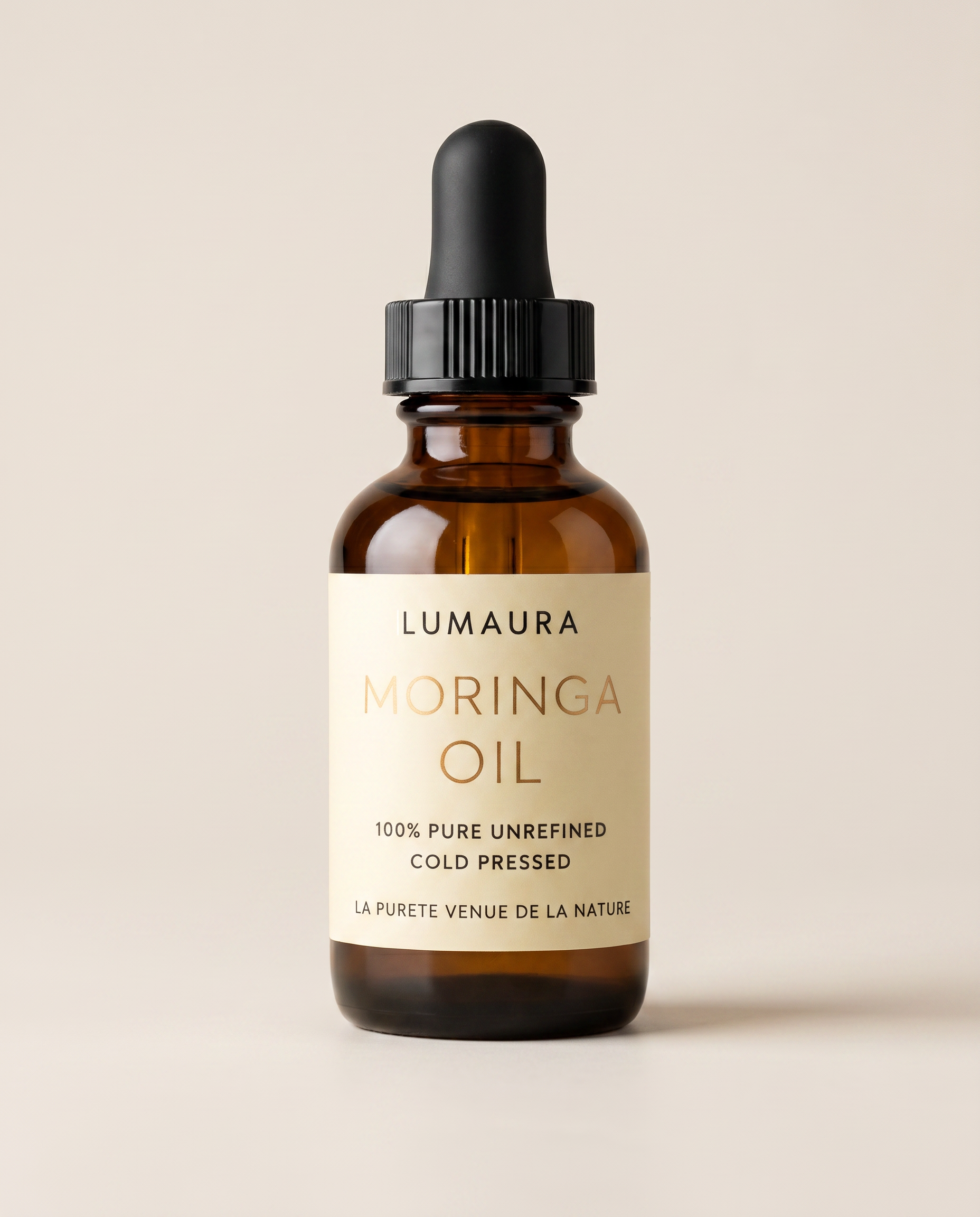 Lumaura pure moringa seed oil in an amber dropper bottle
